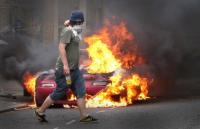 Riot car on fire