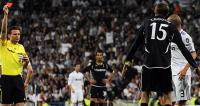 Tottenham Hotspur's Peter Crouch is shown a red card