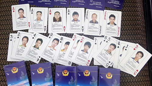 Chinese Cybercrime Mugshots on Deck of Cards; Gambling Den Earning Millions Rumbled by Police