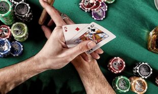 Poker player holding cards