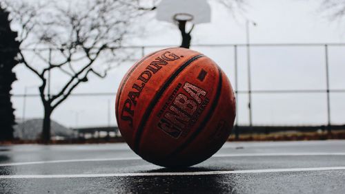 NBA branded basketball on a blacktop court