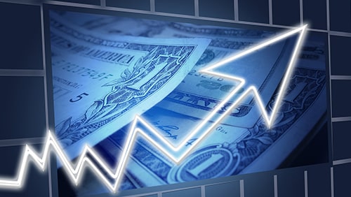 Image of an upward arrow against a background of US dollars. Concept of business profit