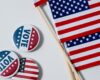 Vote pins and American Flags. Concept of Voting and Election