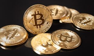Photo of Bitcoins on top of a black surface