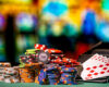 Stacks of poker chips and cards with a blurry casino background. Concept of gambling