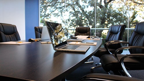 Photo of an office boardroom. Concept of shareholder's meeting