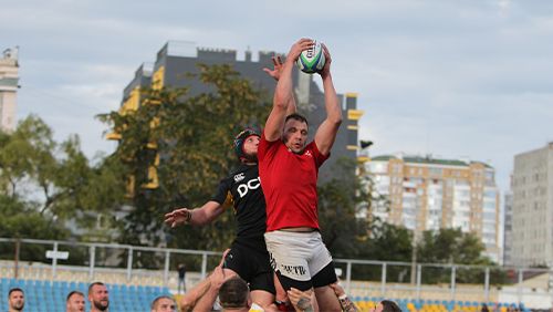 Intense struggle of rugby players for ball