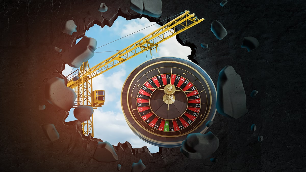 3d rendering of construction crane and casino roulette seen through gap in black wall. concept of casino construction