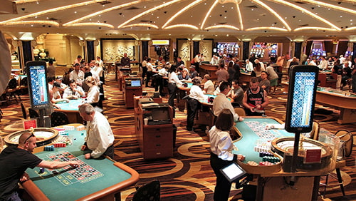 People playing at a casino place