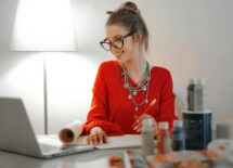 A girl dressed red, working from home