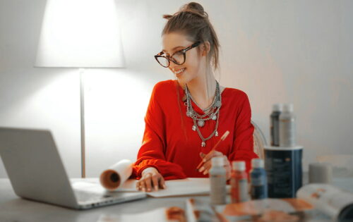 A girl dressed red, working from home