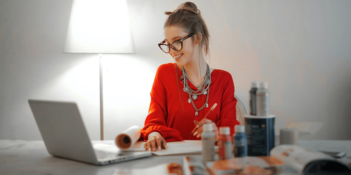 A girl dressed red, working from home