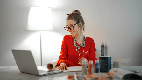 A girl dressed red, working from home