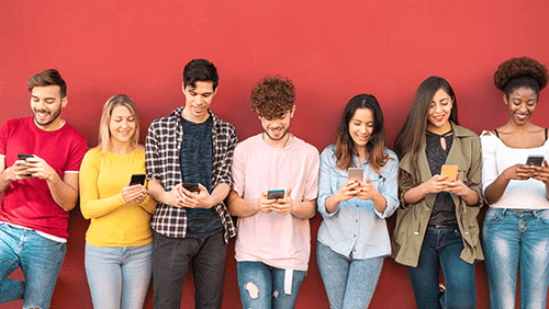 Group of friends using mobile smartphone