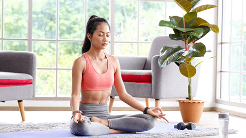 Women meditating at home