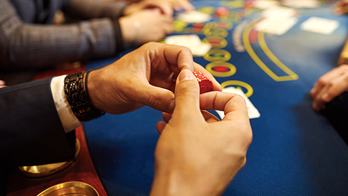 A man holding poker chips