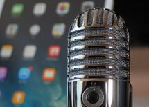 Close-up of a microphone against a blurred background of a tablet
