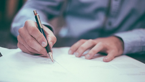 Businessman with pen and paper