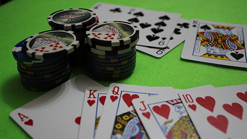 Photo of some casino chips and playing cards