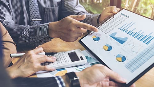 Co working conference Business team meeting present investor colleagues discussing new plan financial graph data on office table with laptop and digital tablet Finance accounting investment