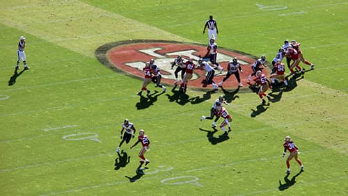 Football players playing on the field