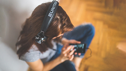 A girl listening music in her headphones