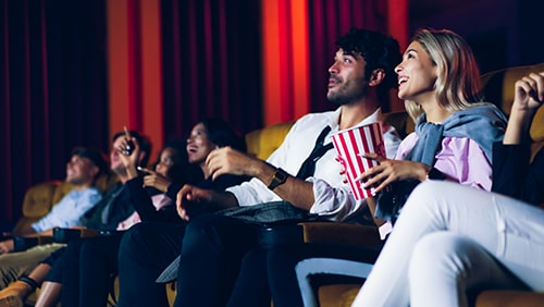 Group of audience happy and fun watch cinema in movie theater.
