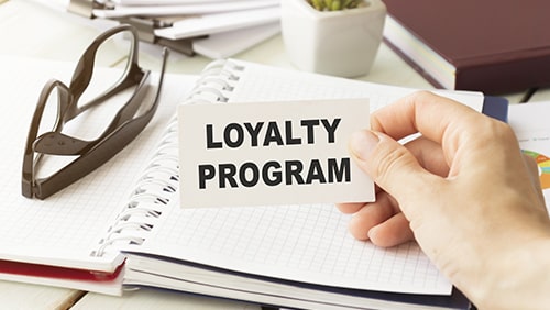 Loyalty Program card with urban background, business concept