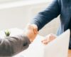 Zoomed photo of business men shaking hands