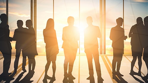 Double exposure image of many business people conference group meeting on city office building in background