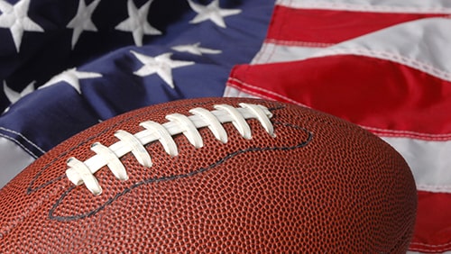 Football with the American Flag in he background