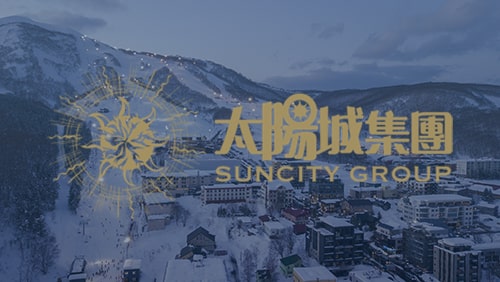 Logo of Suncity Group with the aerial view of Niseko, Hokkiado in the background