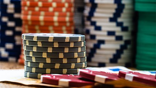 Poker casino chips and money close up