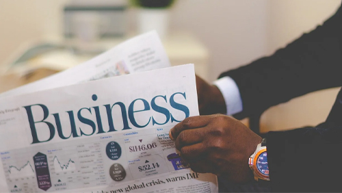 Businessman reading newspaper