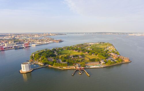 Governors Island and Castle Williams aerial view from New York Harbor, New York City, New York NY, USA.