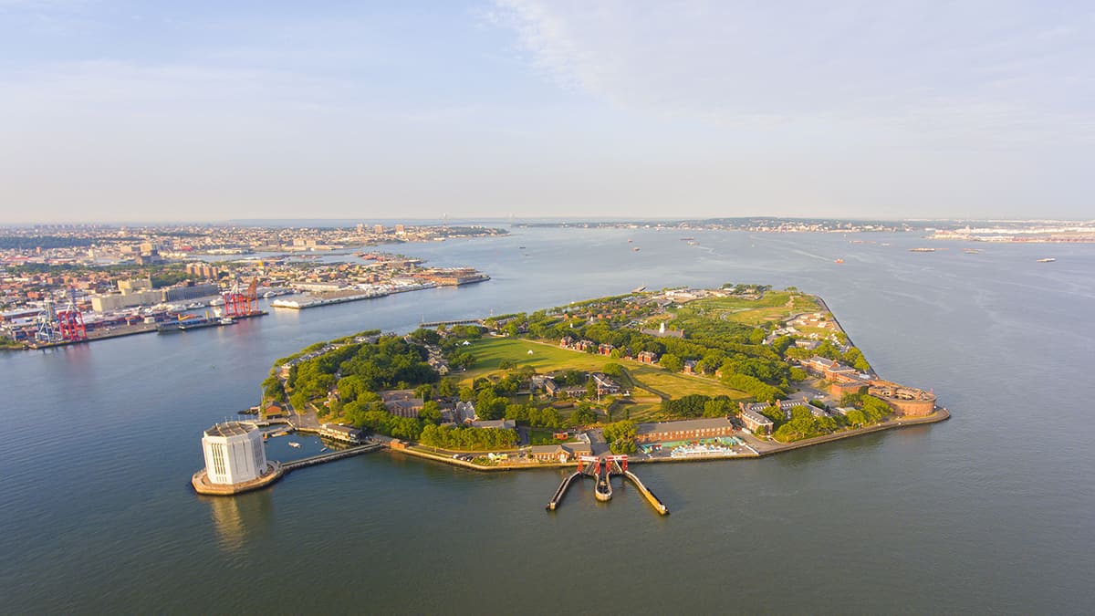 Governors Island and Castle Williams aerial view from New York Harbor, New York City, New York NY, USA.