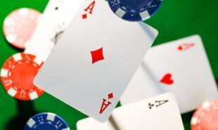 Zoomed photo of poker cards and chips thrown in the air