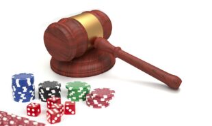 Gavel and casino chips and dice