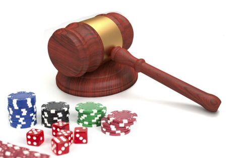 Gavel and casino chips and dice