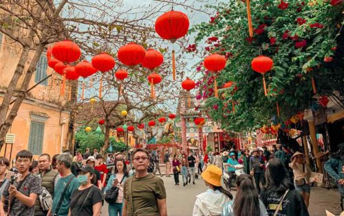 People Walking on Street under Chinese lanterns
