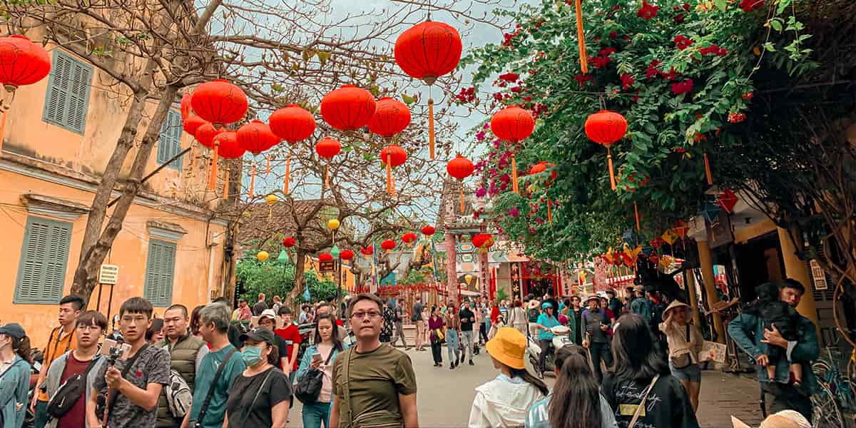 People Walking on Street under Chinese lanterns