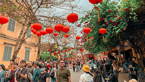 People Walking on Street under Chinese lanterns