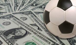 US dollars and a soccer ball