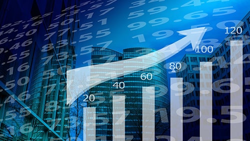 Stocks charts on a background of business buildings