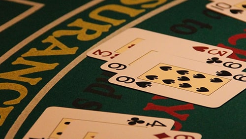 Playing cards on top of a casino table