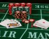 Casino card game showing chips on green cloth background