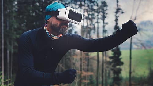 Person Wearing Black Henley Shirt and White Vr Goggles